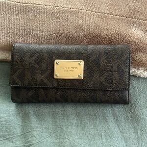 Micheal Kors Trifold Checkbook Wallet | Color: Brown with logo | Size: Os
